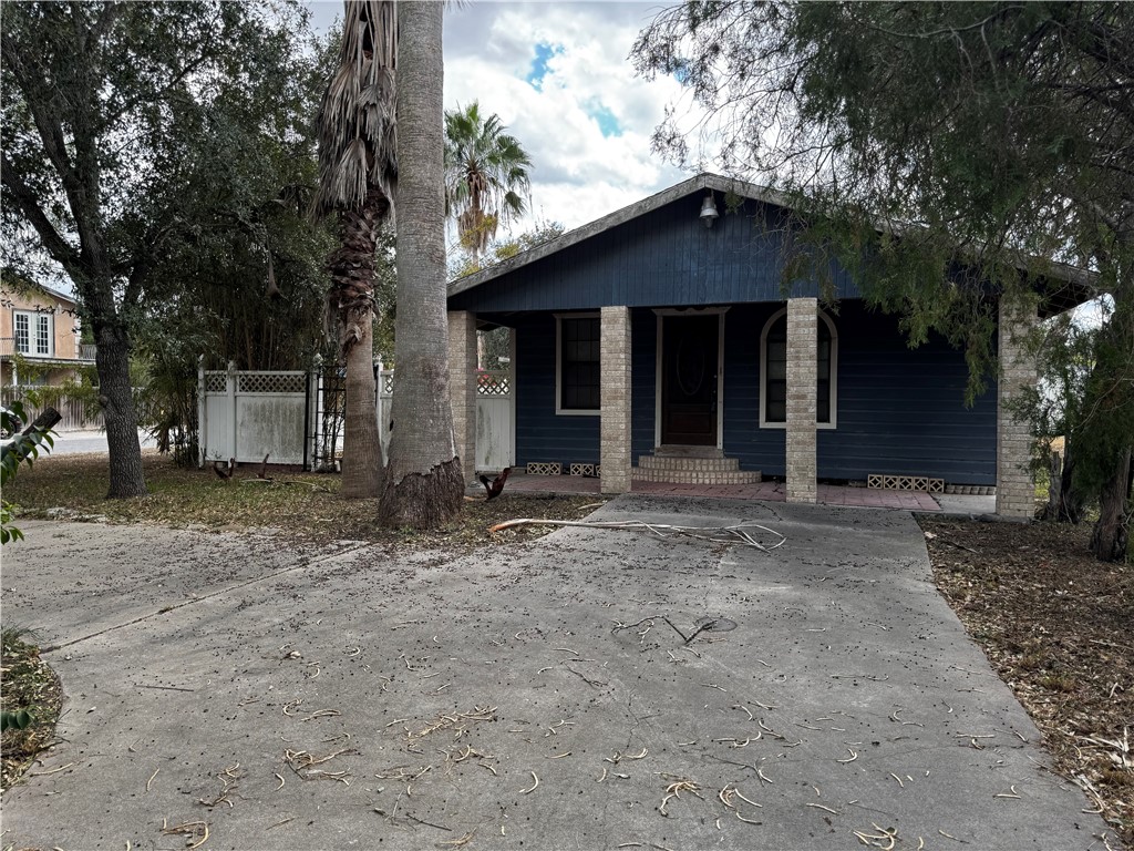200 West 5th Street Alice, TX 78332 - Photo 3 of 4 a front view of a house with a yard and garage