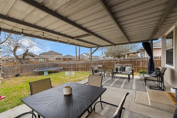a view of a swimming pool with outdoor seating