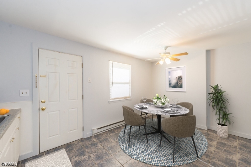 62 King Cole Road, Unit 14 Hamburg, NJ 07419 - Photo 3 of 7 a dining room with furniture and window