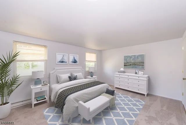 a bedroom with a bed and a couch