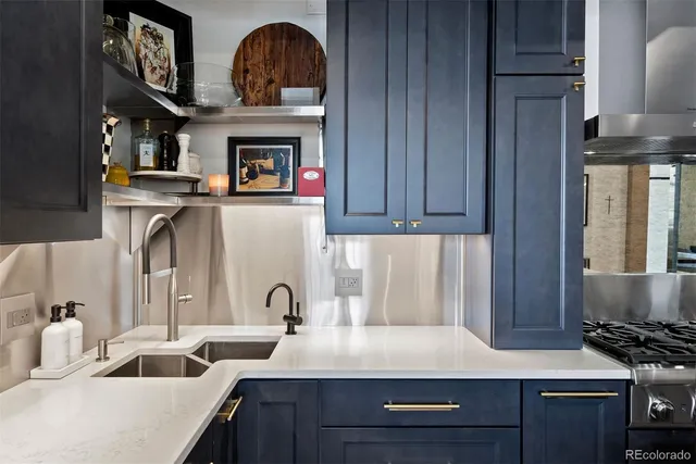 a kitchen with refrigerator and stove