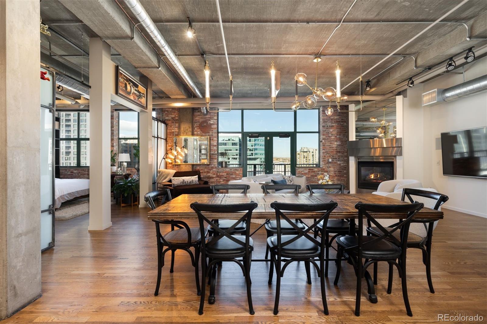 1801 Wynkoop Street, Unit 603 Denver, CO 80202 - Photo 18 of 40 a view of a dining room with furniture window and wooden floor