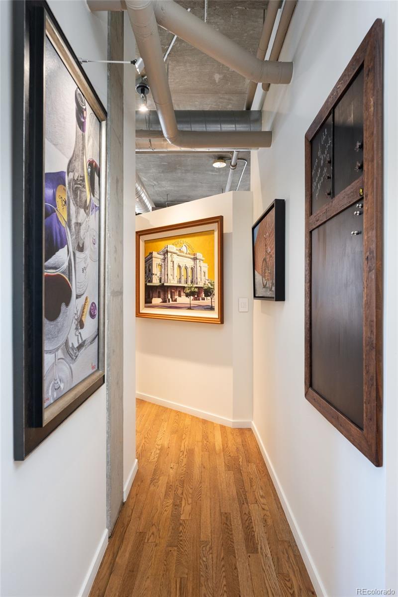 1801 Wynkoop Street, Unit 603 Denver, CO 80202 - Photo 21 of 40 a view of a hallway with wooden floor