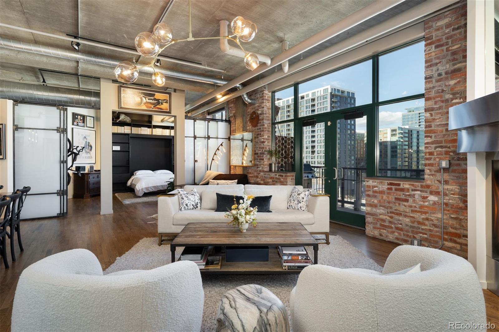 1801 Wynkoop Street, Unit 603 Denver, CO 80202 - Photo 22 of 40 a living room with furniture and a fireplace
