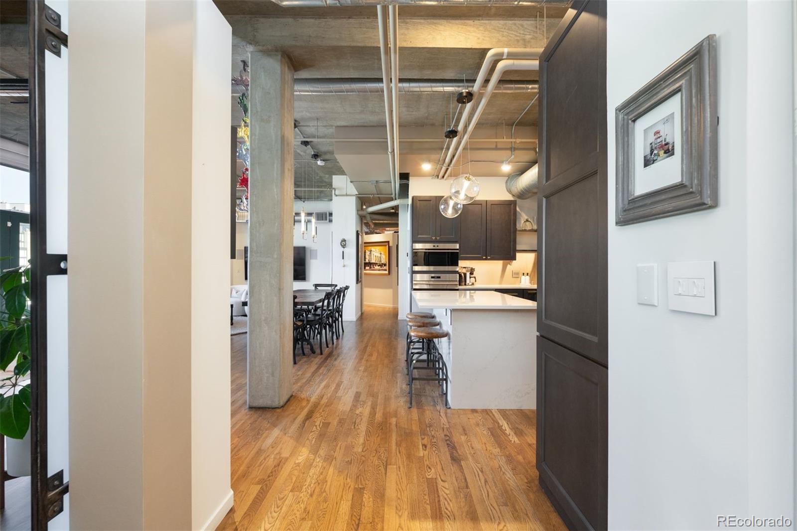 1801 Wynkoop Street, Unit 603 Denver, CO 80202 - Photo 27 of 40 a view of a living room with wooden floor