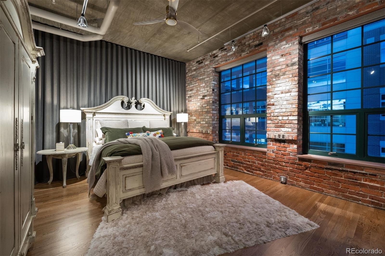 1801 Wynkoop Street, Unit 603 Denver, CO 80202 - Photo 4 of 40 a bed room with a bed and a large window