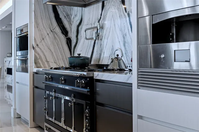 a kitchen with a stove and a shower