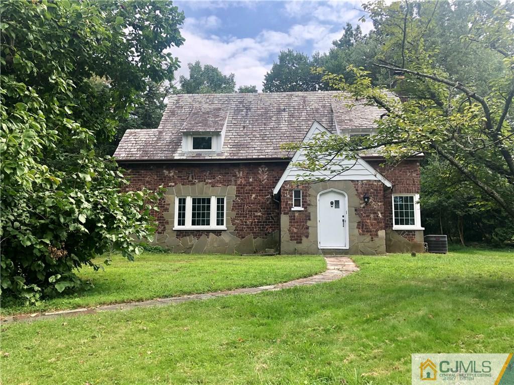 425 Chain O' Hills Road Colonia, NJ 07067 - Photo 1 of 16 a front view of house with yard and green space