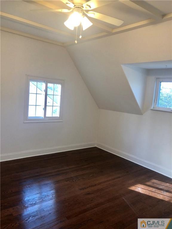 425 Chain O' Hills Road Colonia, NJ 07067 - Photo 11 of 16 a view of an empty room with wooden floor and a window