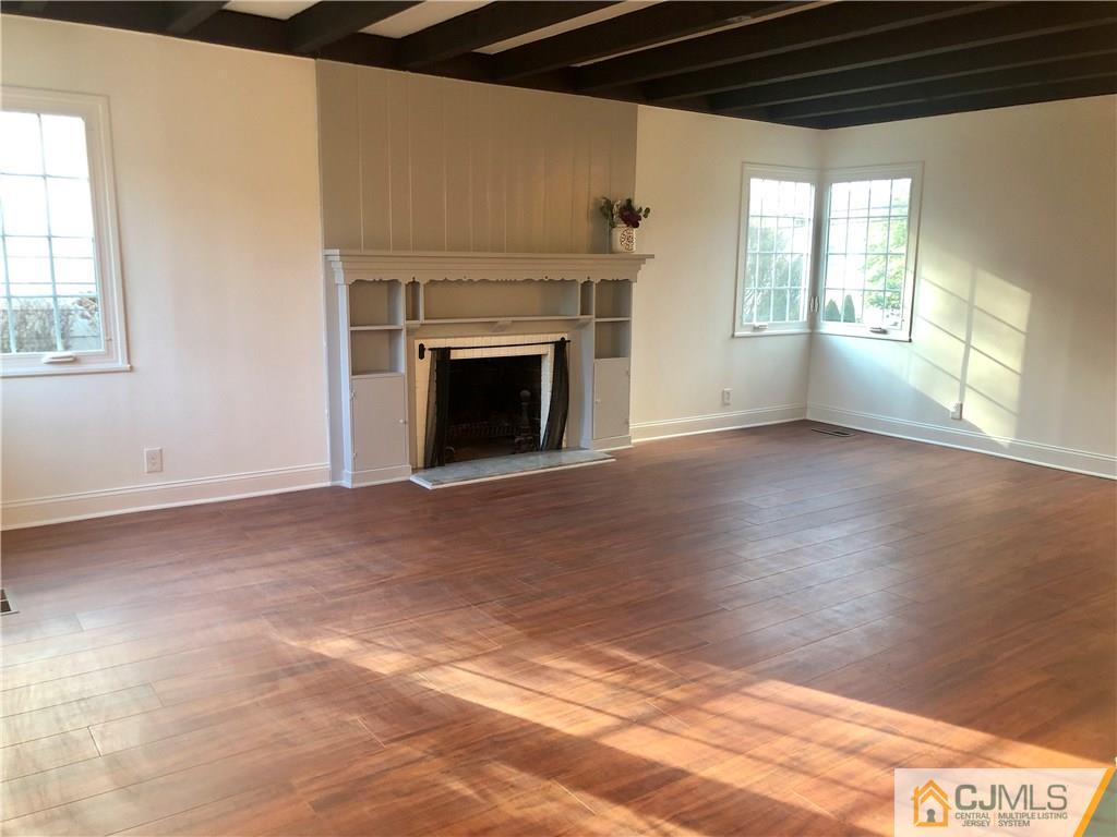 425 Chain O' Hills Road Colonia, NJ 07067 - Photo 8 of 16 a view of empty room with a fireplace