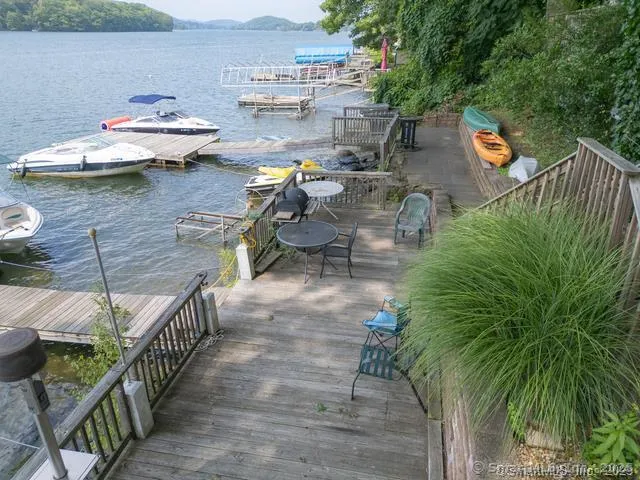 a view of a lake with furniture