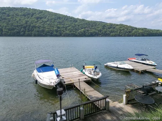 a view of a house with wooden deck