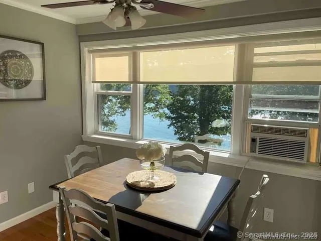 a view of a dining room with furniture window and outside view