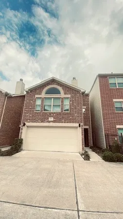 a front view of a house with a barbeque