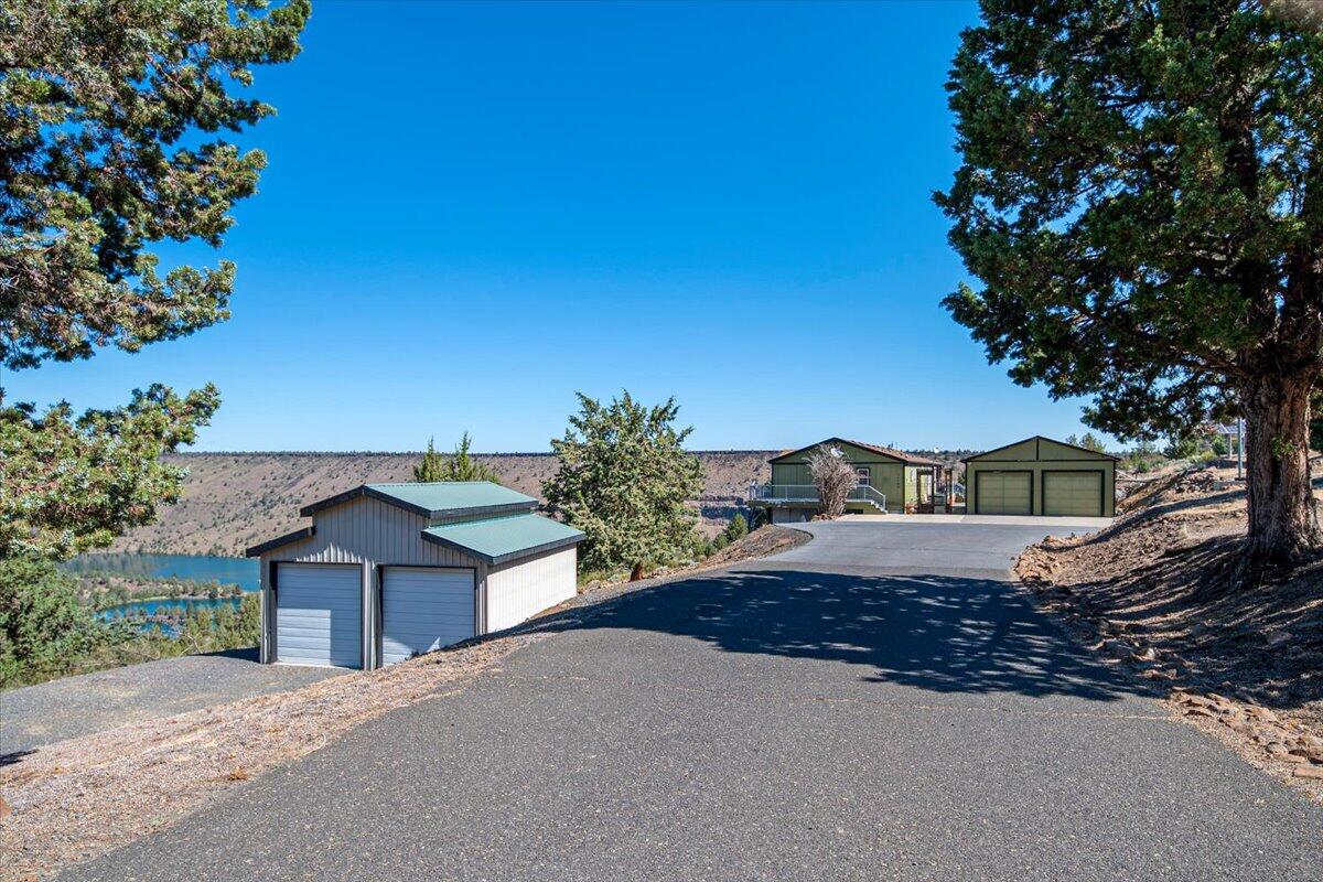 11182 Southwest Dynamite Lane Culver, OR 97734 - Photo 65 of 70 a view of a house with a yard and large tree