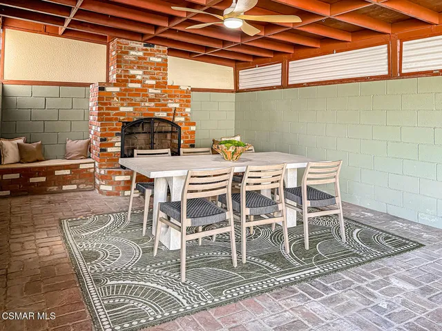 a patio with table and chairs