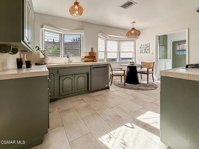 a kitchen with a sink and counter top space