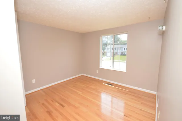 a view of small space with wooden floor