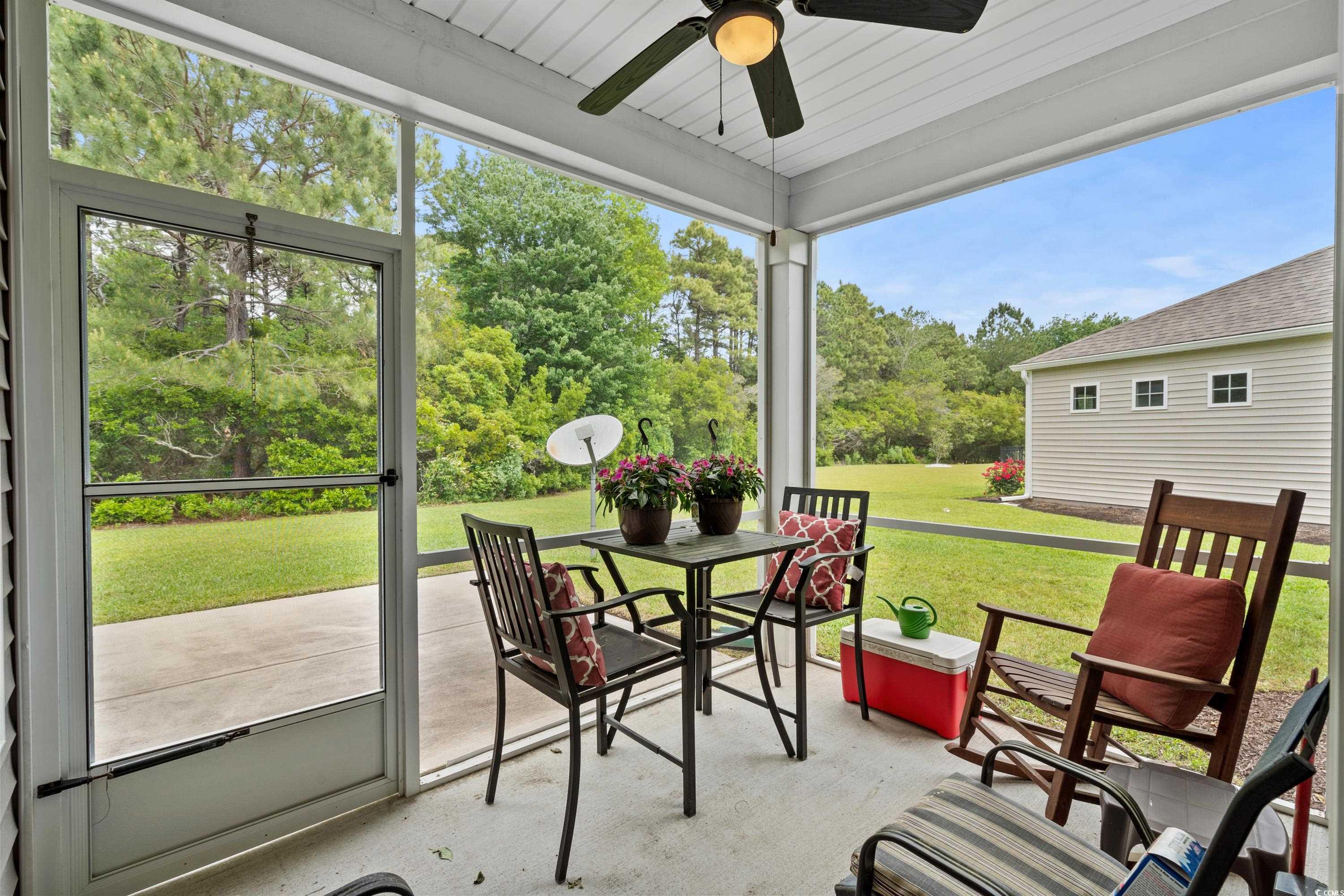 4246 Livorn Loop Myrtle Beach, SC 29579 - Photo 16 of 40 Sunroom featuring outdoor dining area and a ceiling fan