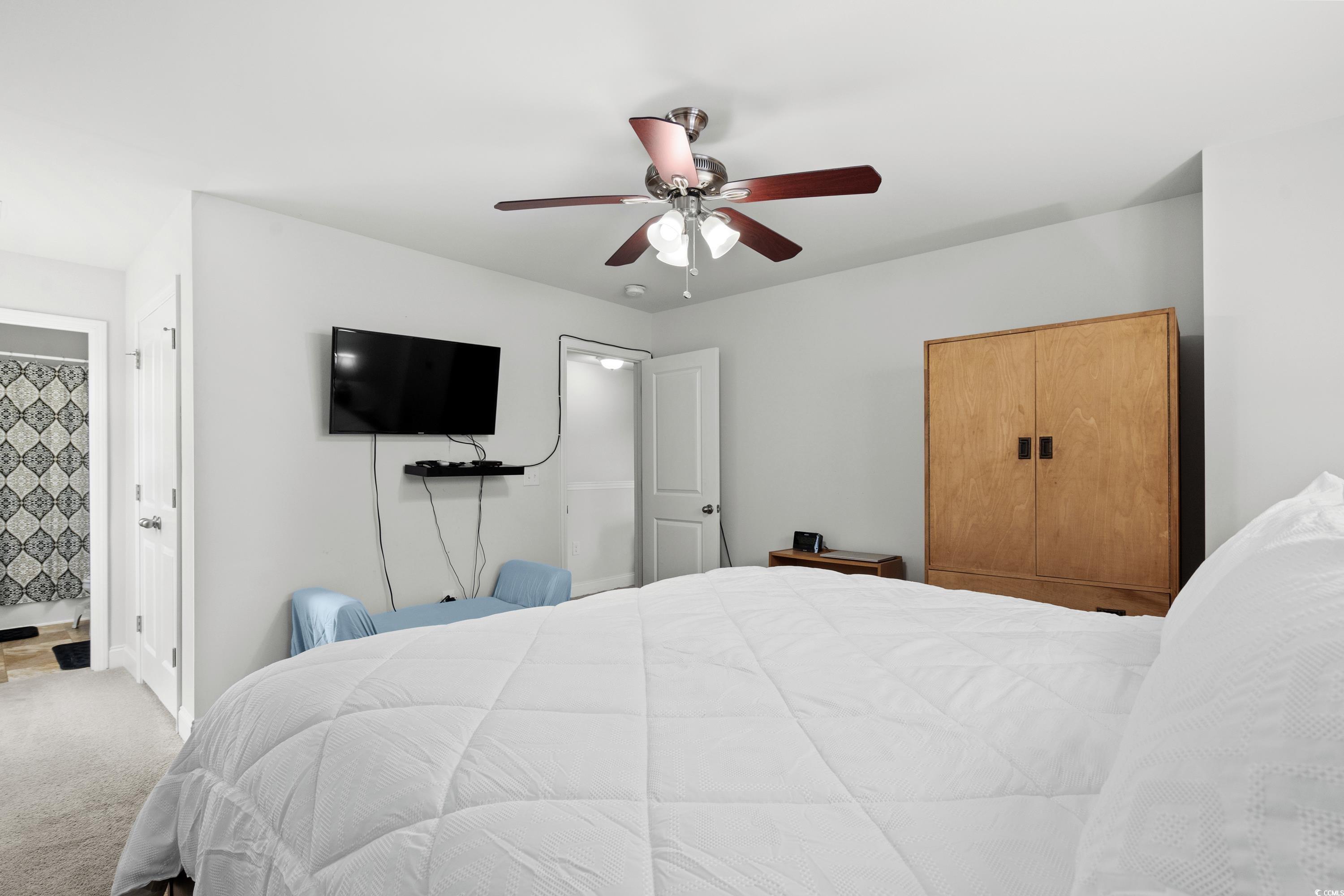 4246 Livorn Loop Myrtle Beach, SC 29579 - Photo 26 of 40 Bedroom featuring ensuite bathroom, carpet flooring, and ceiling fan