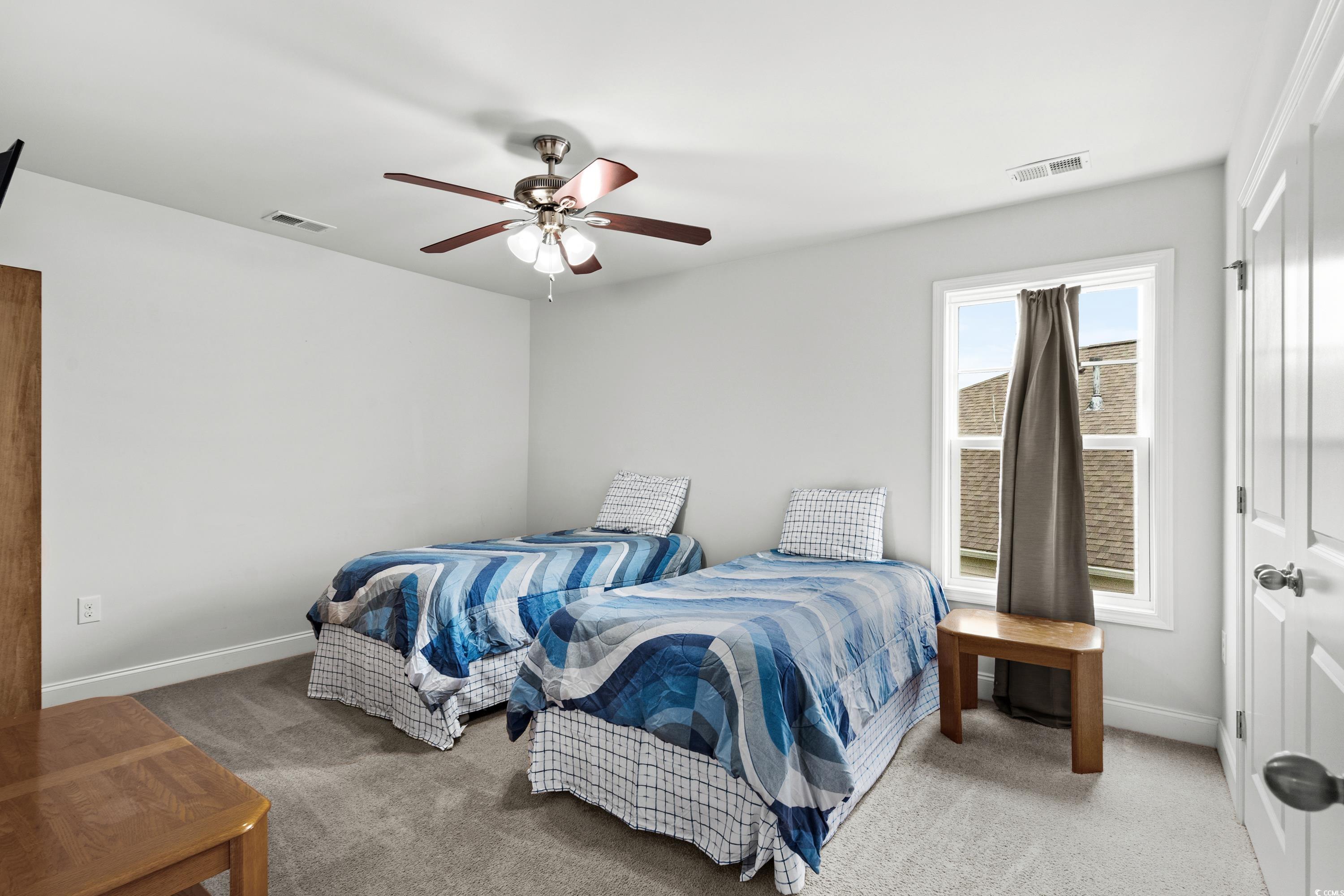4246 Livorn Loop Myrtle Beach, SC 29579 - Photo 29 of 40 Carpeted bedroom featuring baseboards, a ceiling fan, and visible vents