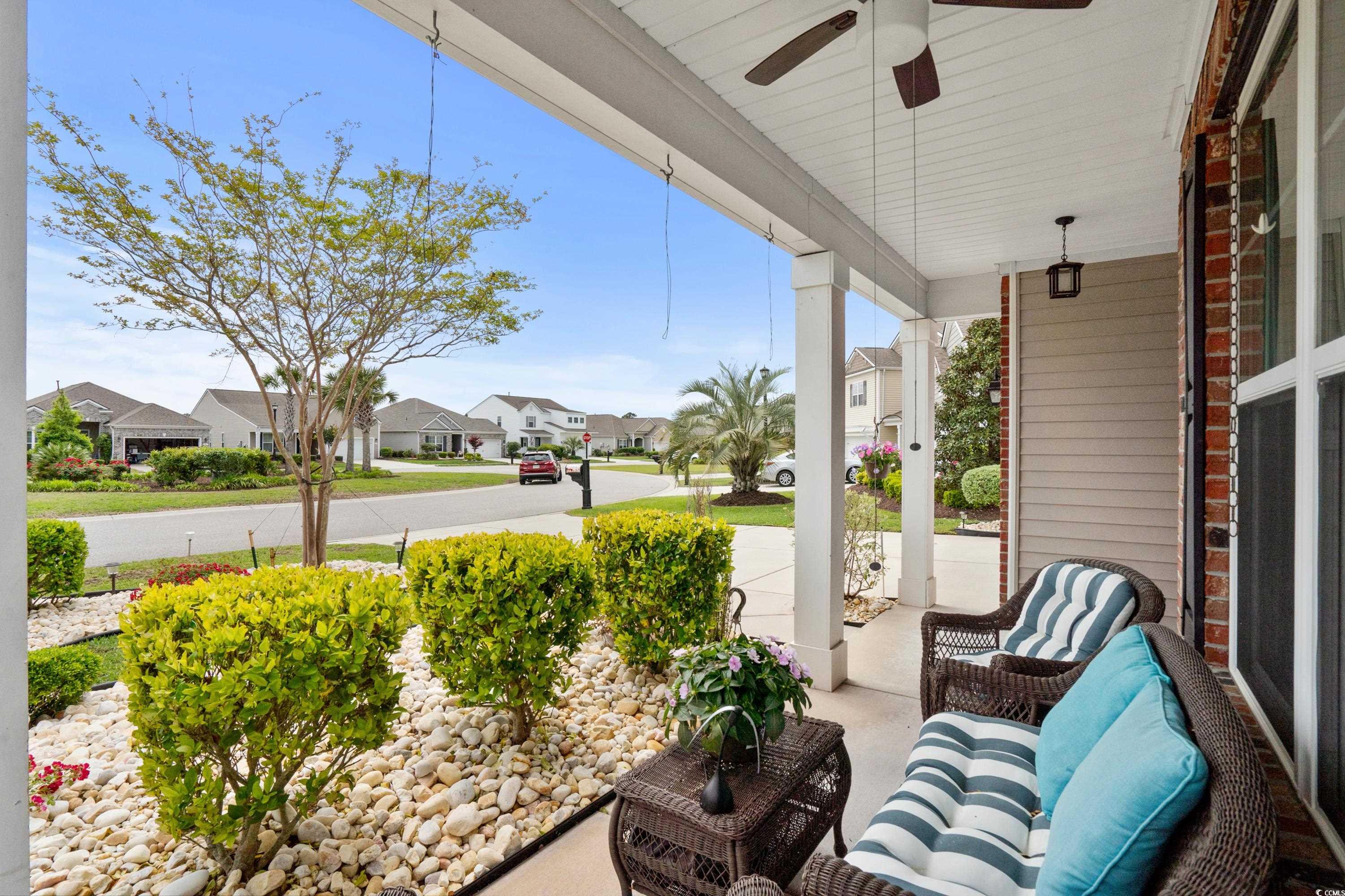 4246 Livorn Loop Myrtle Beach, SC 29579 - Photo 5 of 40 View of patio / terrace featuring a porch, a ceiling fan, and a residential view