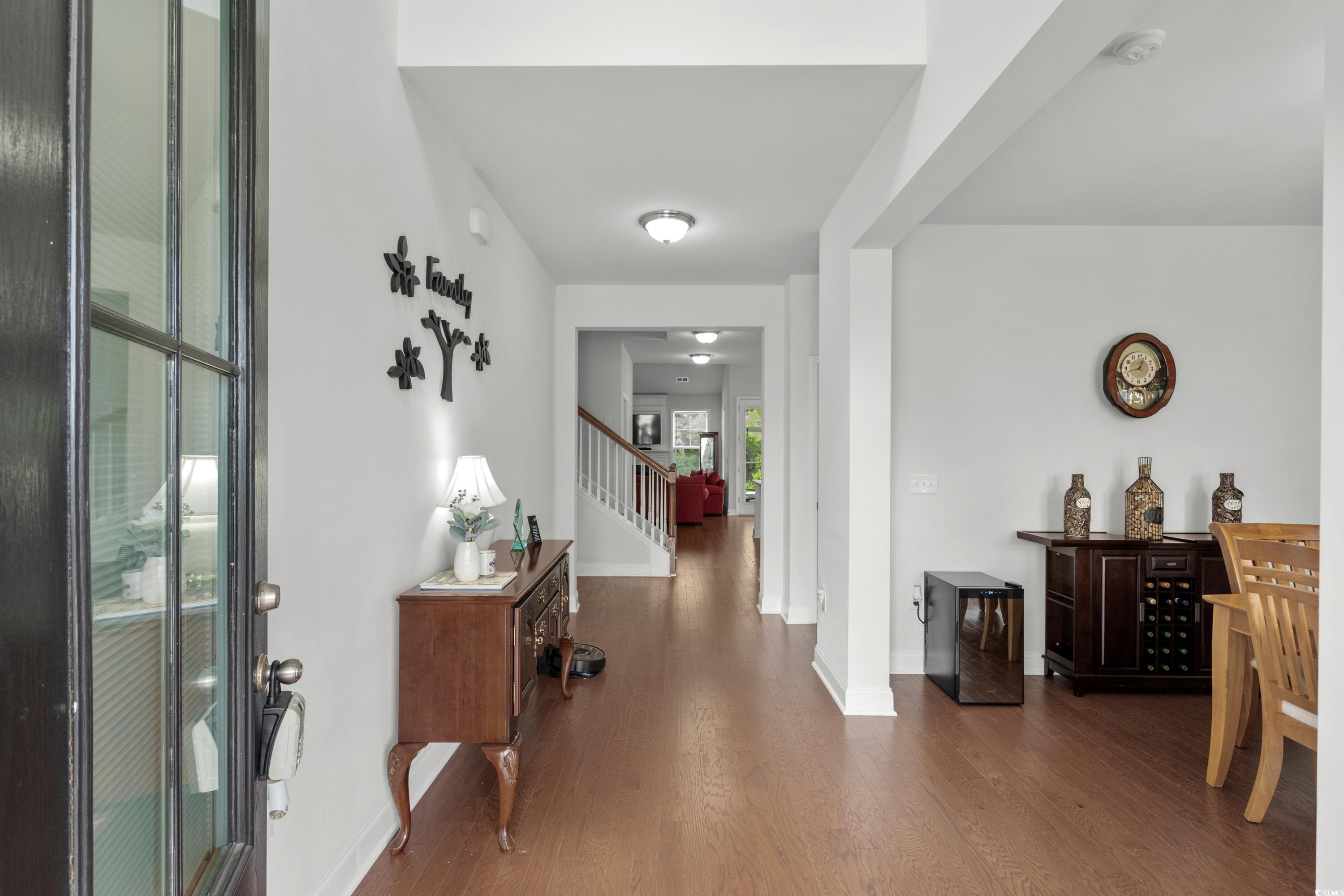 4246 Livorn Loop Myrtle Beach, SC 29579 - Photo 6 of 40 Entrance foyer featuring stairway, baseboards, and wood finished floors