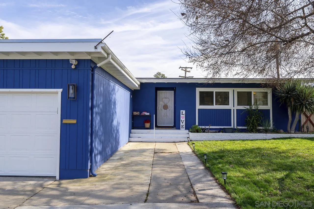 a front view of a house with a yard and porch