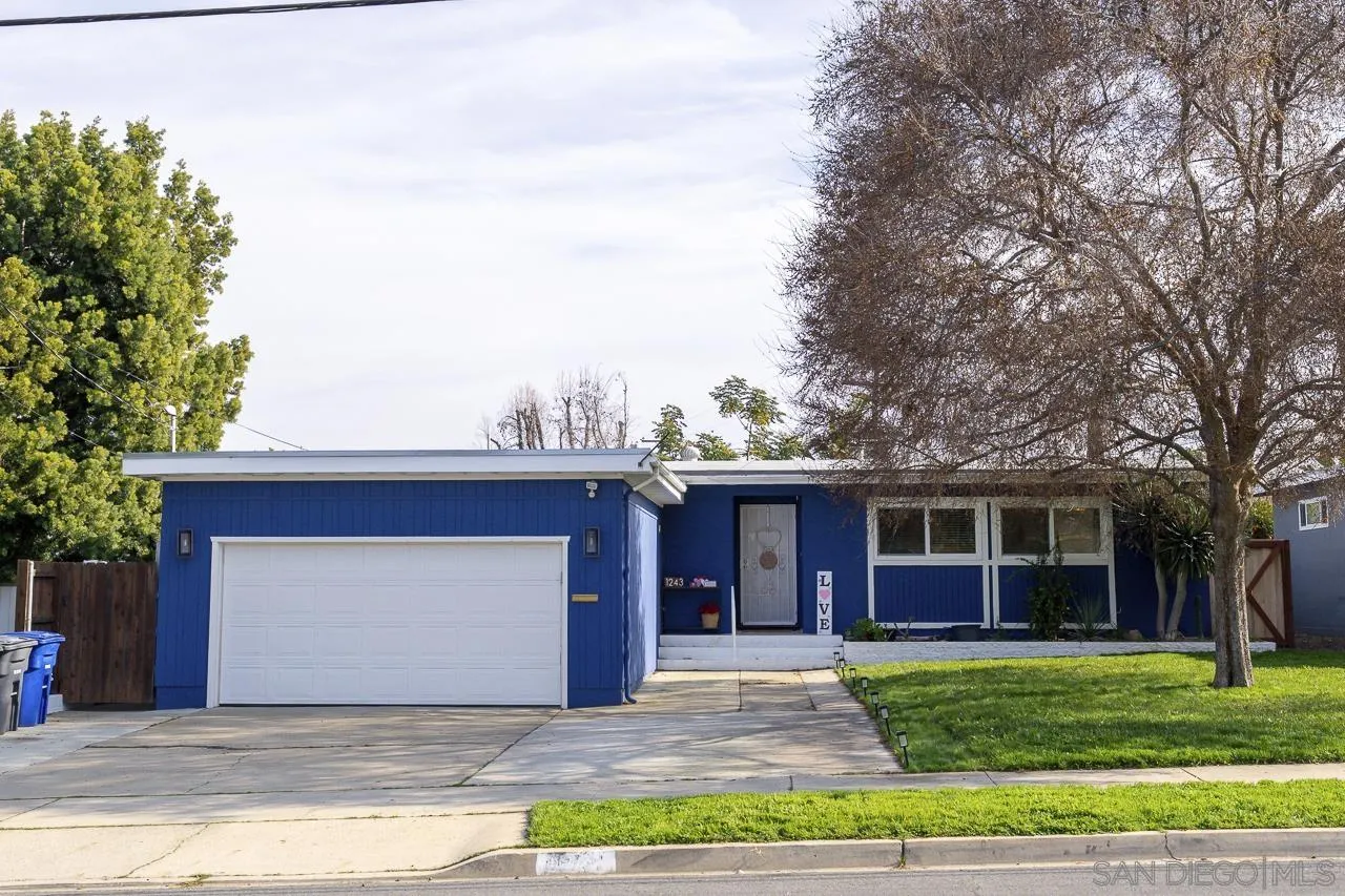 1243 Hardin Drive El Cajon, CA 92020 - Photo 4 of 32 a front view of a house with a garden and trees