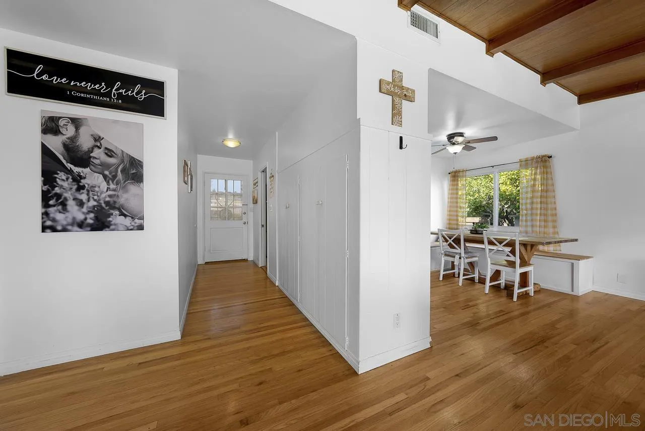1243 Hardin Drive El Cajon, CA 92020 - Photo 5 of 32 a view of a hallway to a livingroom with furniture and window