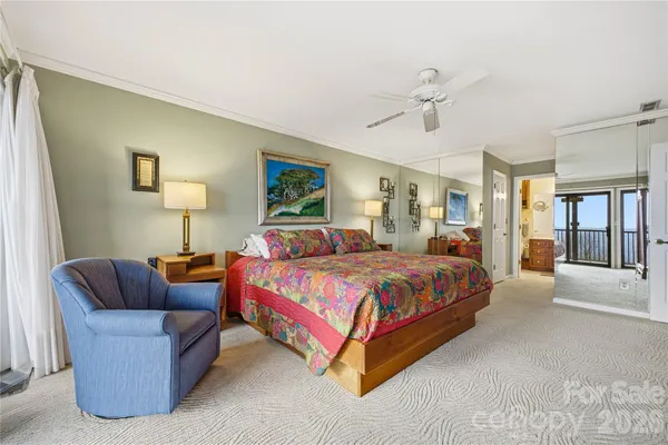 a bedroom with a bed couch and window