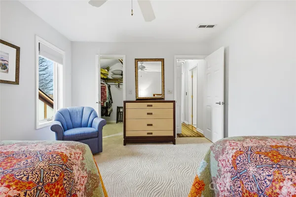 a bedroom with a bed and a couch