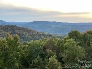 a view of an aerial view of residential houses with a yard