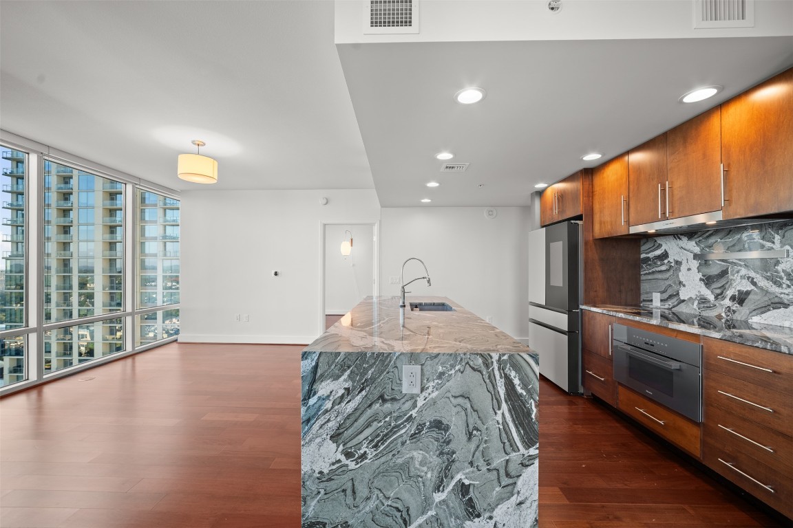 300 Bowie Street, Unit 2405 Austin, TX 78703 - Photo 12 of 39 a view of a kitchen with a sink and cabinets