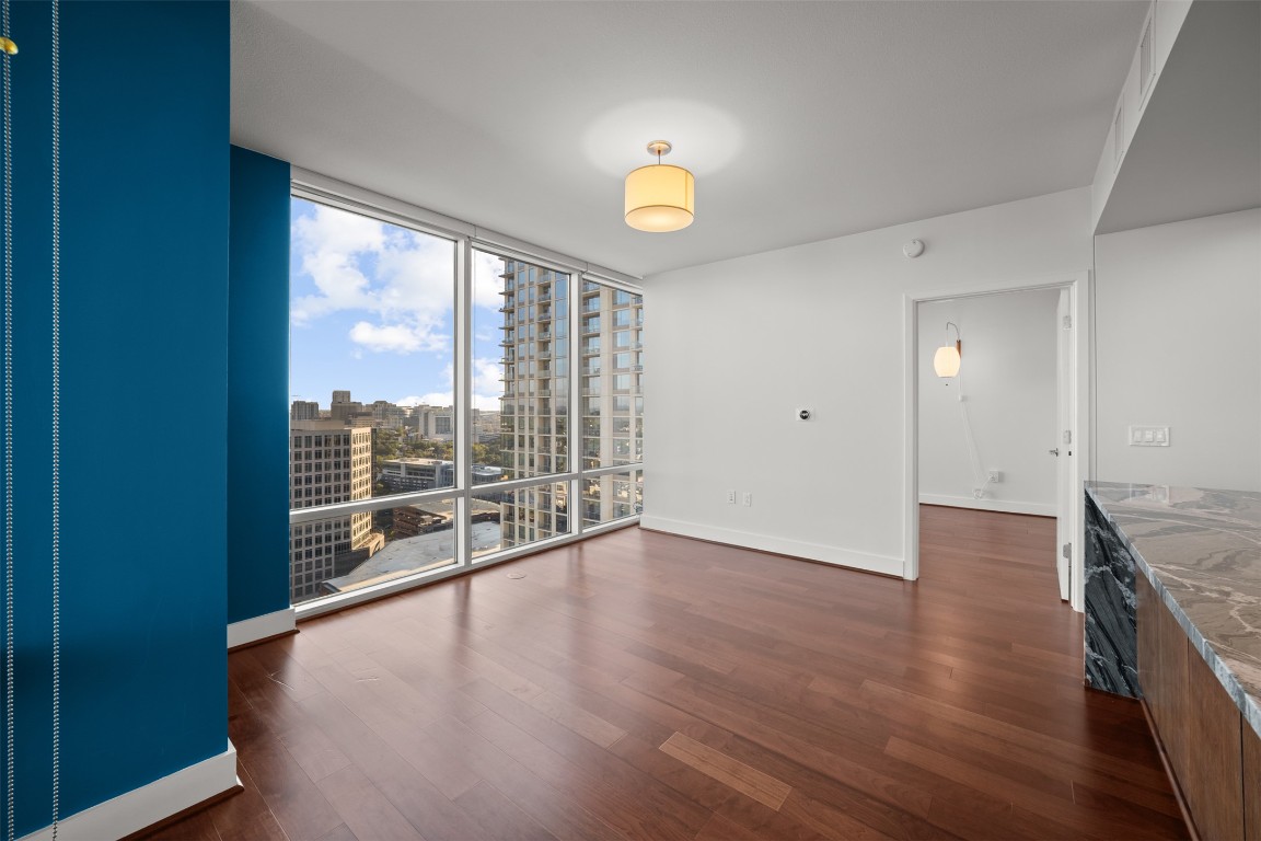 300 Bowie Street, Unit 2405 Austin, TX 78703 - Photo 15 of 39 wooden floor in an empty room with a window