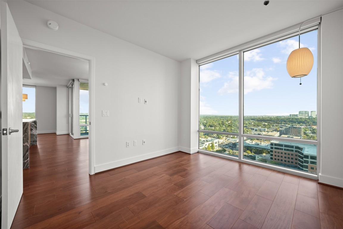 300 Bowie Street, Unit 2405 Austin, TX 78703 - Photo 18 of 39 a view of a room with wooden floor and window