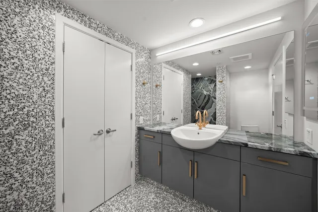 a bathroom with a sink and a mirror