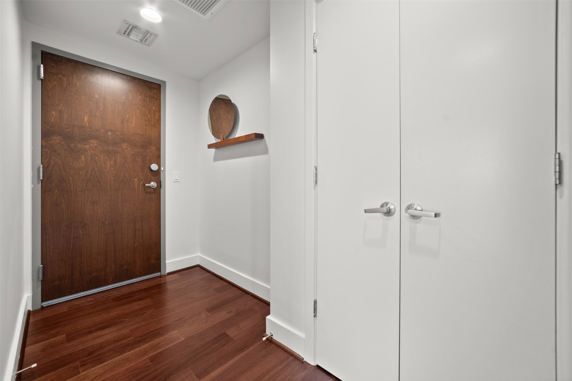 300 Bowie Street, Unit 2405 Austin, TX 78703 - Photo 2 of 39 a view of empty room with wooden floor