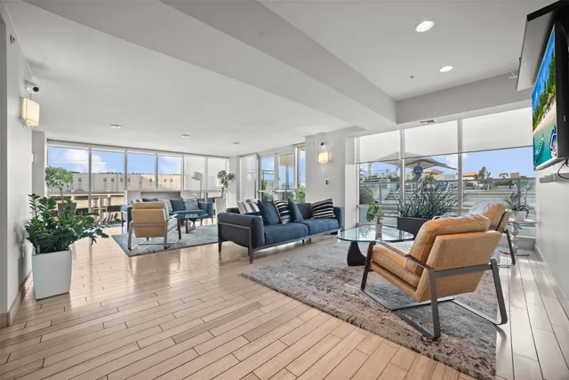 a living room with lots of furniture and wooden floor