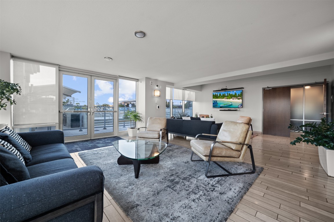 300 Bowie Street, Unit 2405 Austin, TX 78703 - Photo 32 of 39 a living room with furniture and a large window