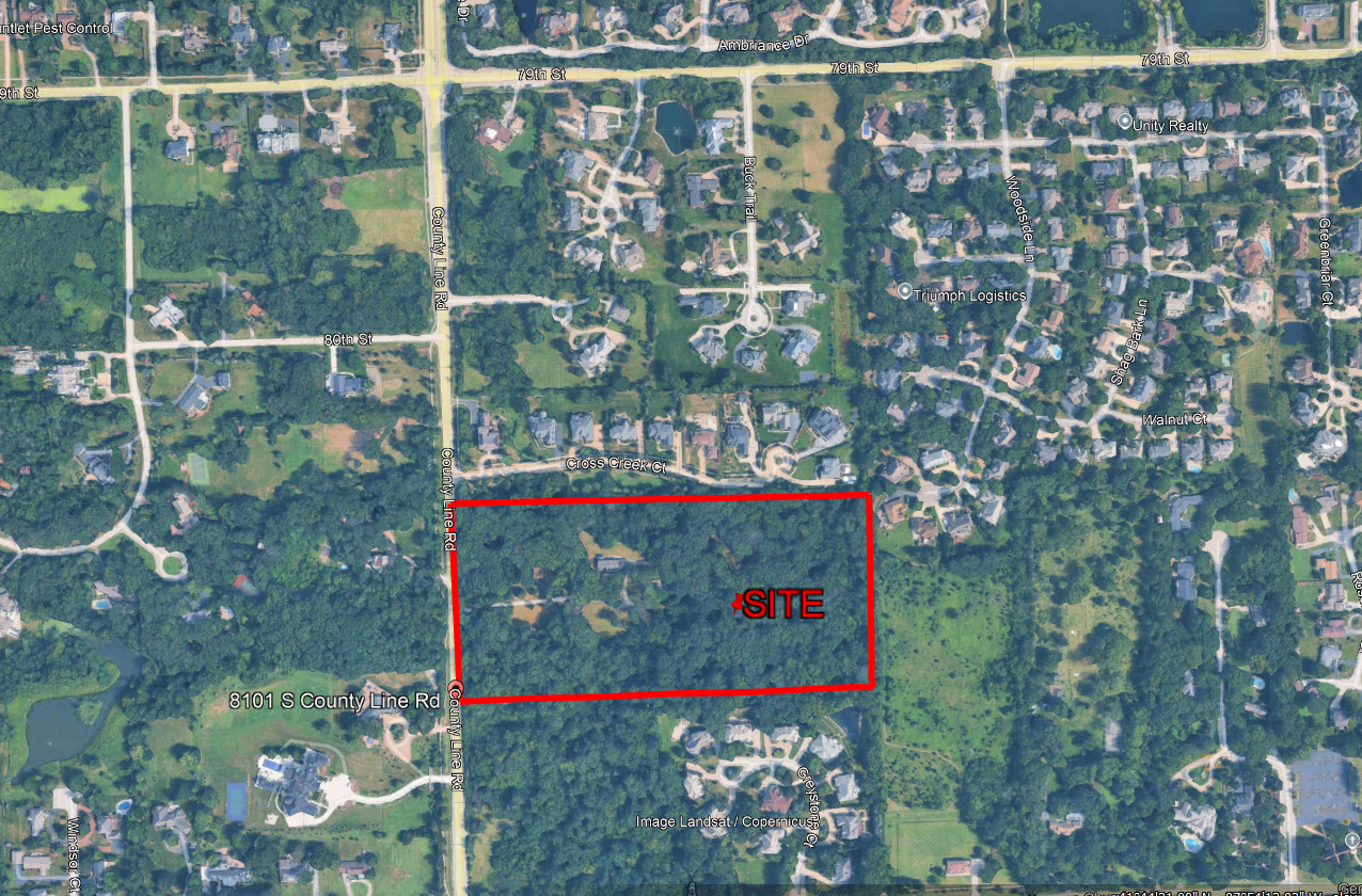 a view of water with a tree in the background