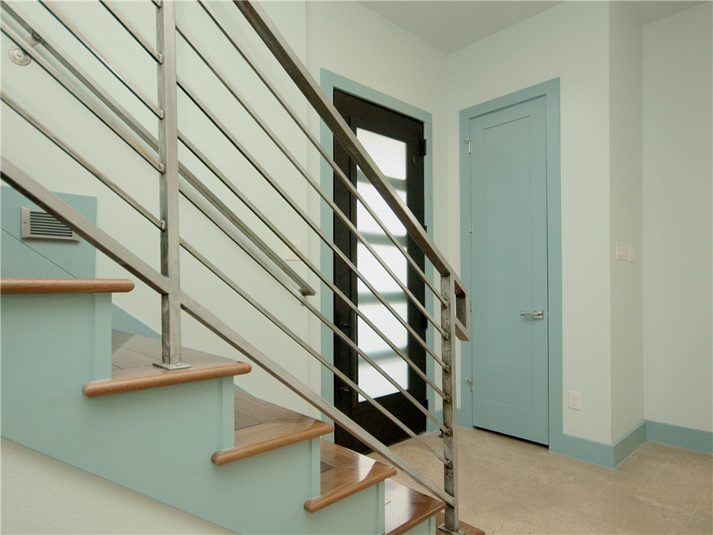 306 Franklin Boulevard, Unit B Austin, TX 78751 - Photo 12 of 23 a view of staircase with wooden floor and white walls
