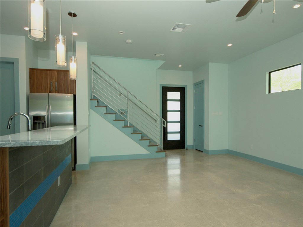 306 Franklin Boulevard, Unit B Austin, TX 78751 - Photo 8 of 23 a view of a kitchen with a sink and a window