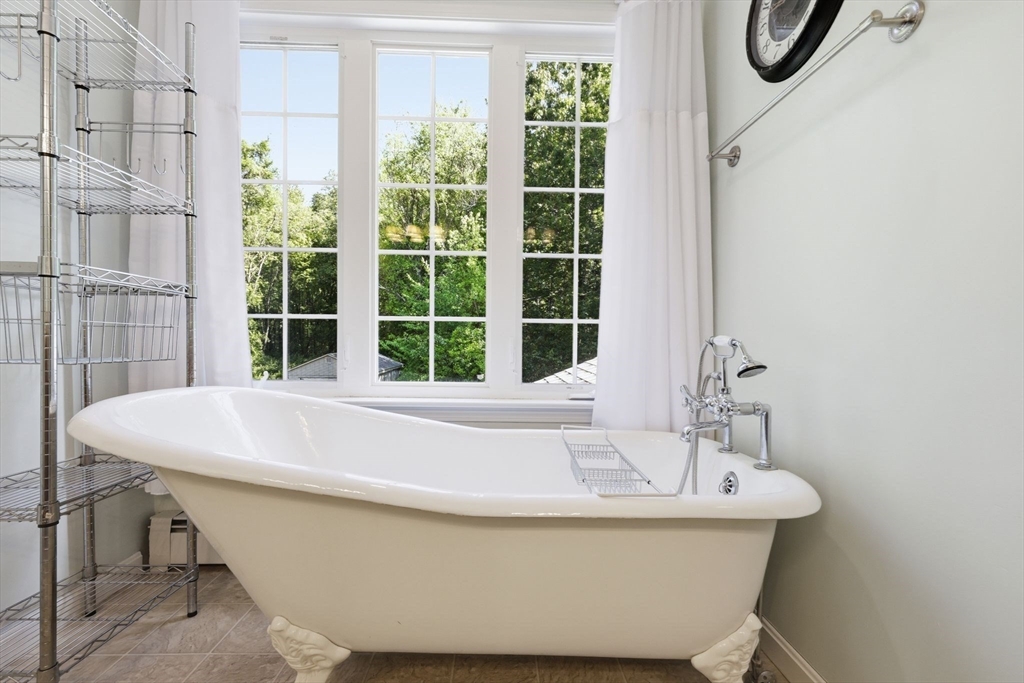 345 Bragg Road Warren, MA 01585 - Photo 26 of 41 a white bath tub sitting next to a window