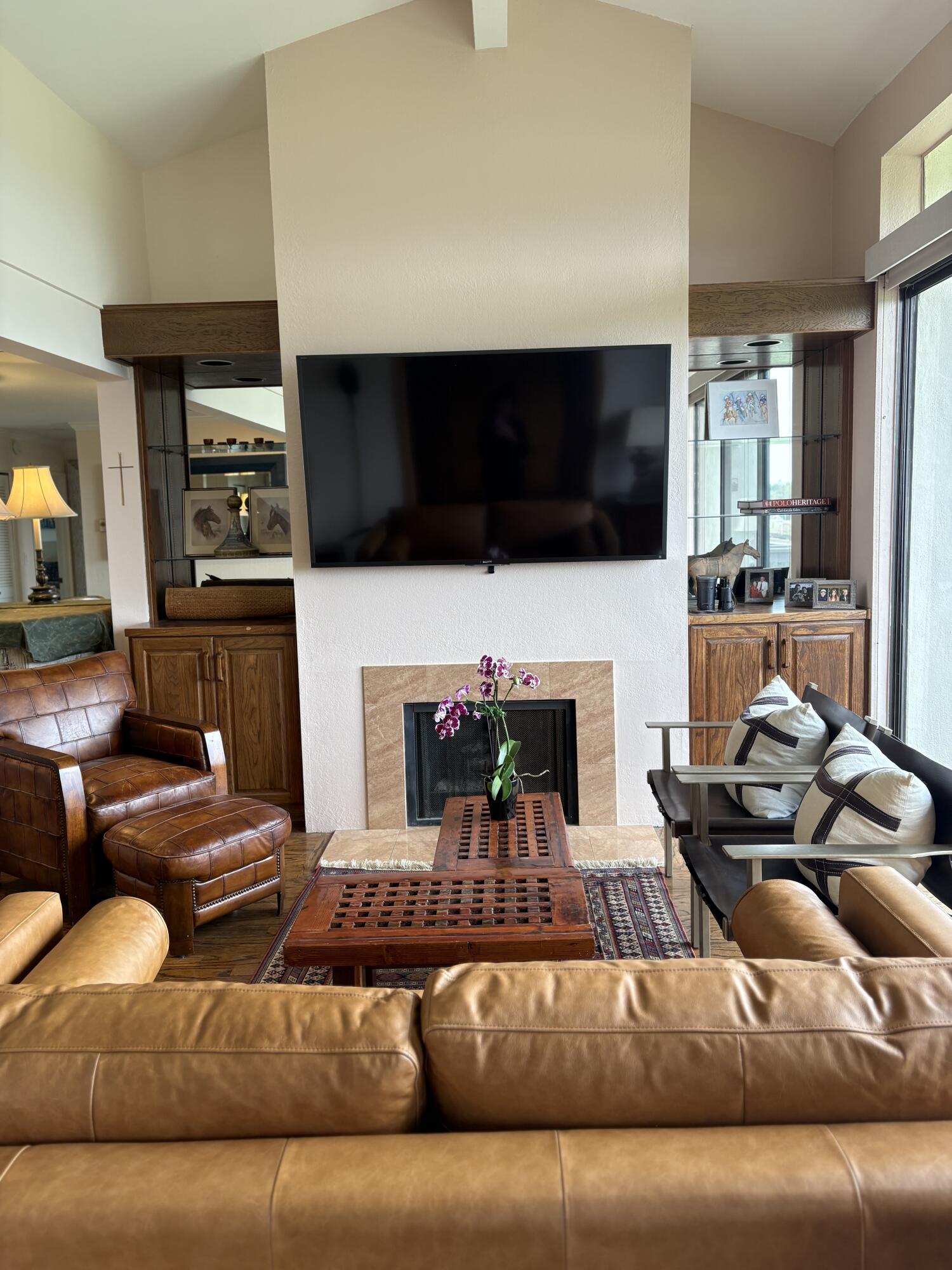 3375 Foothill Road, Unit 533 Carpinteria, CA 93013 - Photo 4 of 12 a living room with furniture fireplace and flat screen tv
