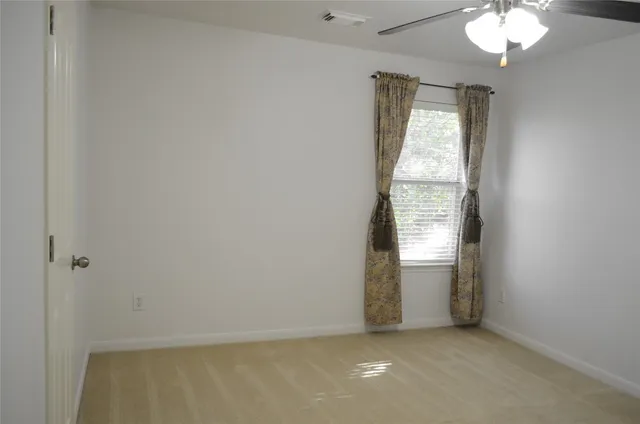 an empty room that has a window in it