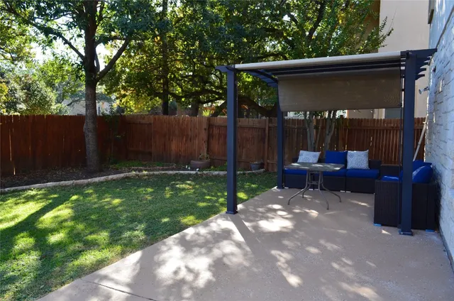 a view of a couches in backyard of house