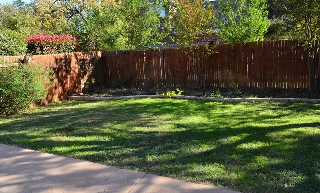 a swimming pool with wooden fence