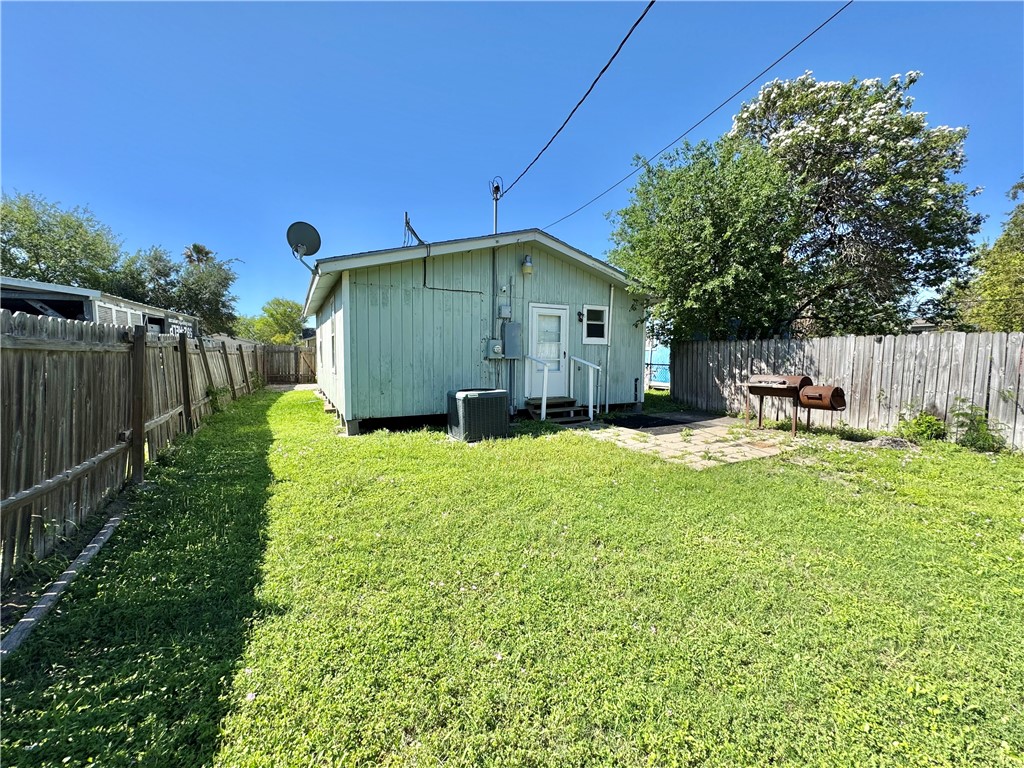 710 East C Avenue Kingsville, TX 78363 - Photo 11 of 13 a front view of a house with garden