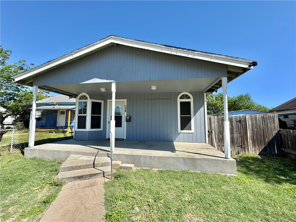 710 East C Avenue Kingsville, TX 78363 - Photo 2 of 13 a front view of a house with garden